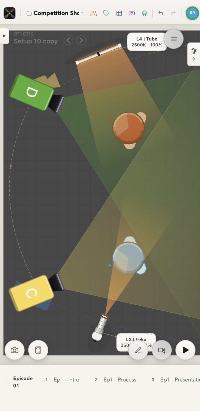 The plot on iPhone with two of its lights, the L4 tube and the L3 Leko at 2500K, throwing warm beams across two subjects while cameras C and D cover the same ground