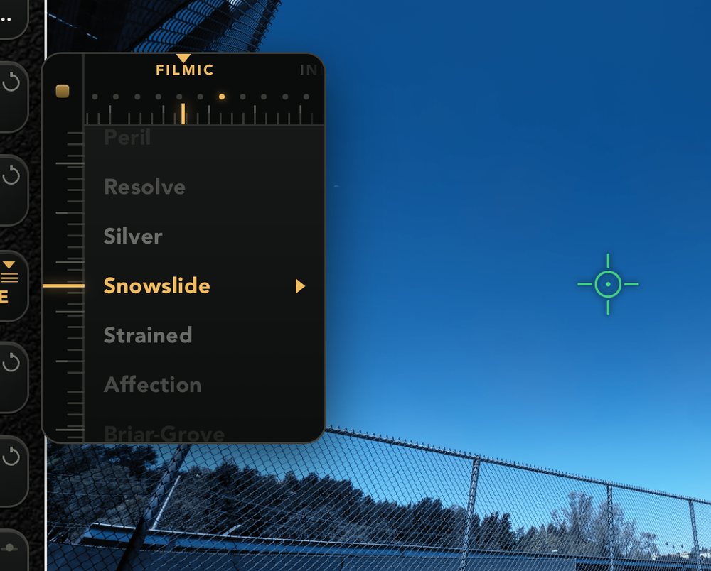 The LUT dial open on the Filmic shelf — Peril, Resolve, Silver, Snowslide, Strained — over a cool blue sky frame