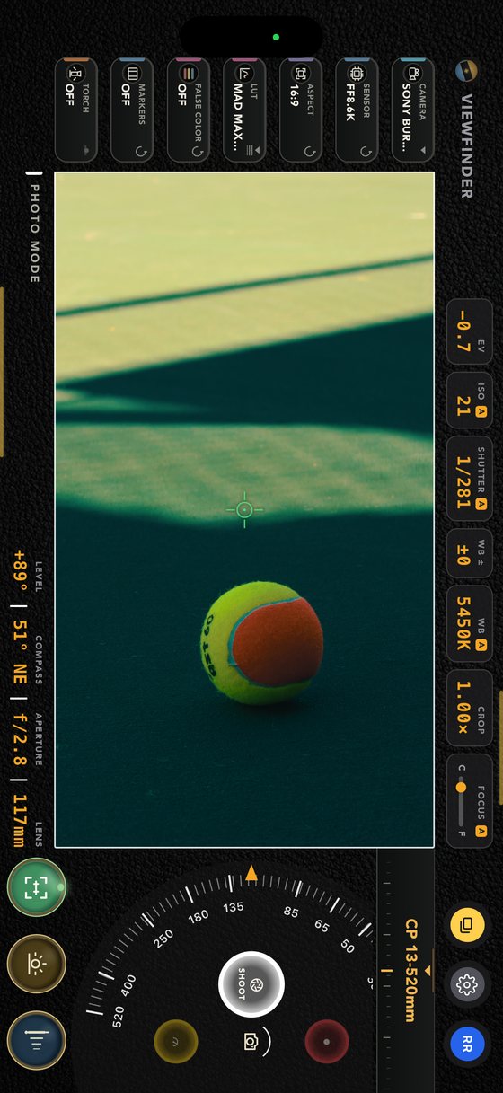 The viewfinder with the phone held upright — a tall frame filling the screen, the readouts running down the sides, at 117mm